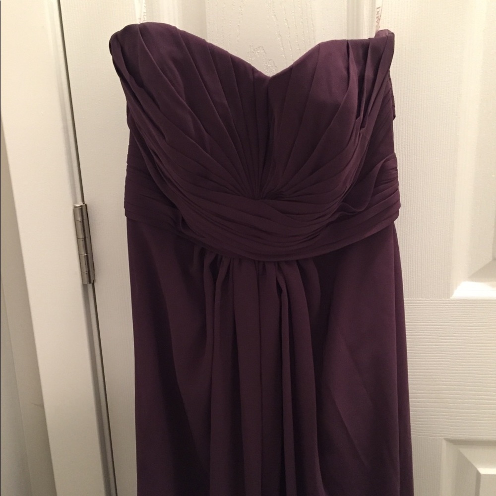 Floor length plum dress.